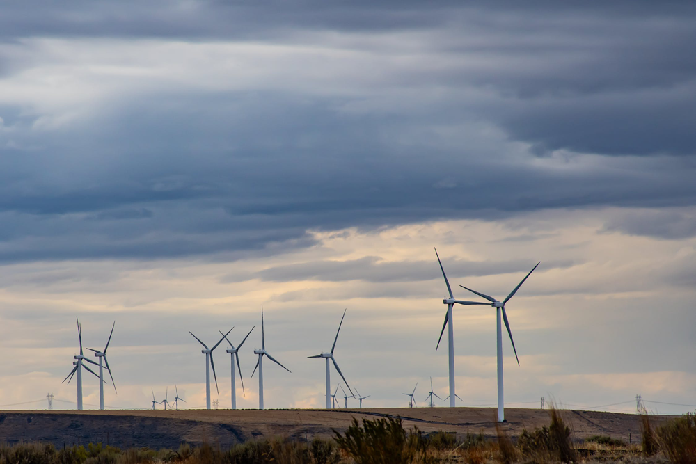 wind turbine farm and cloudy sky