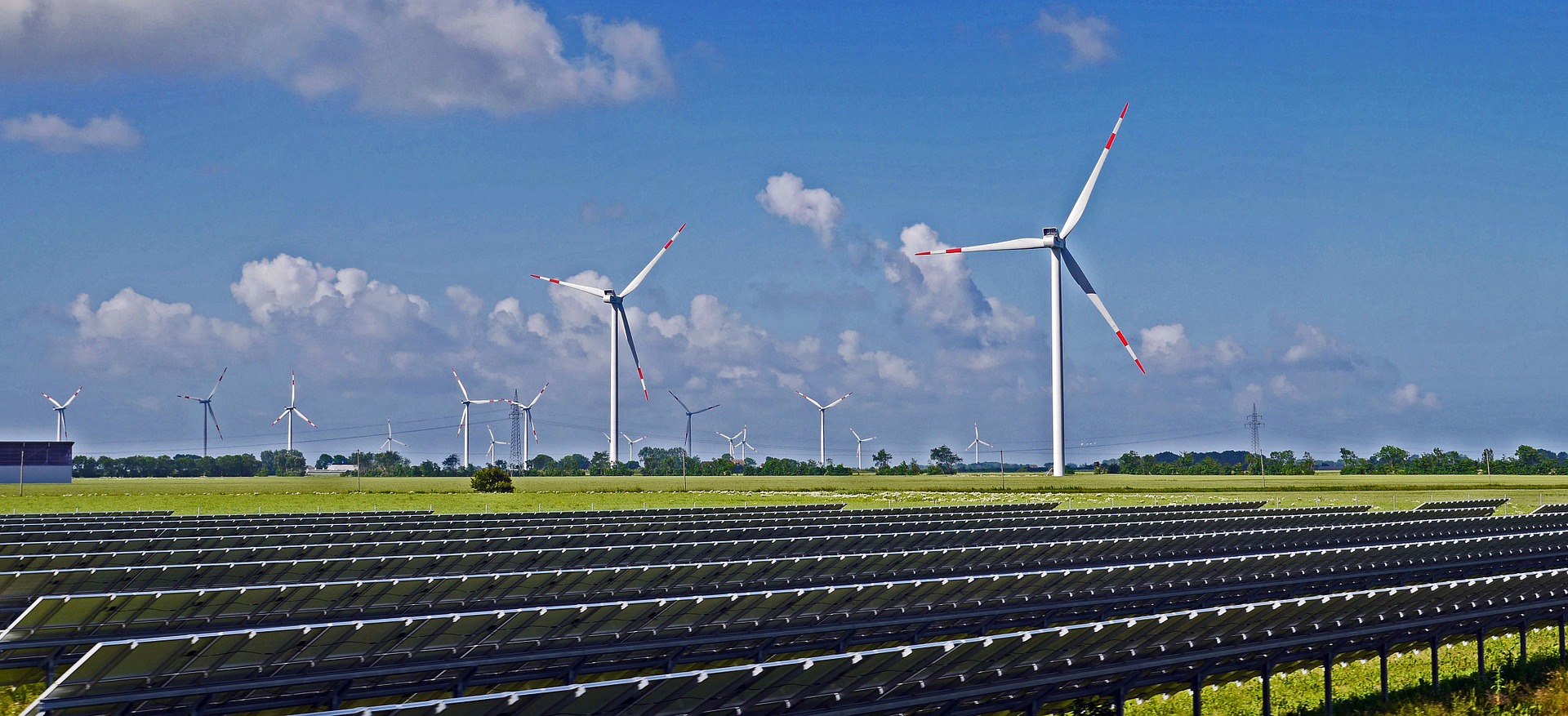 hybrid wind and solar farm on a bright sunny day