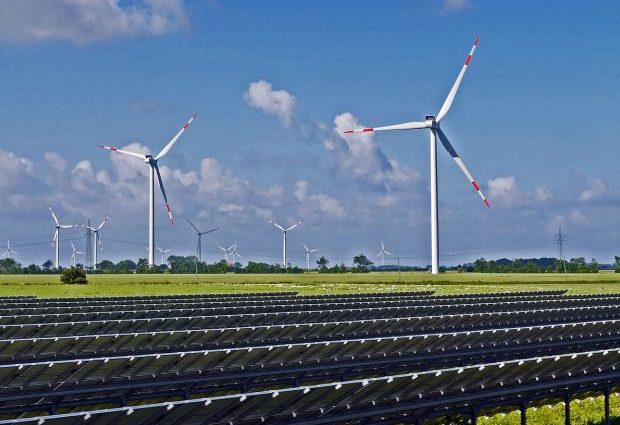 hybrid wind and solar farm on a bright sunny day