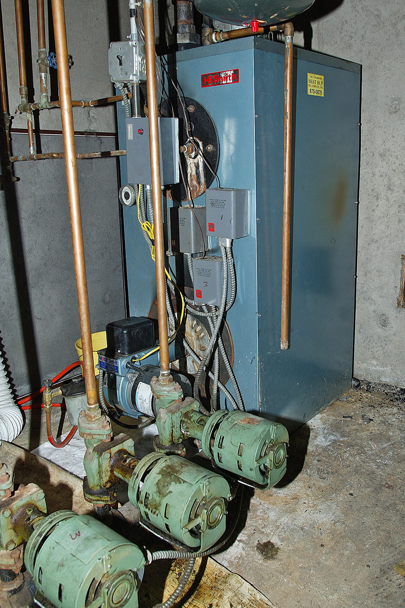 Boiler room as viewed through a screen share during a remote video inspection